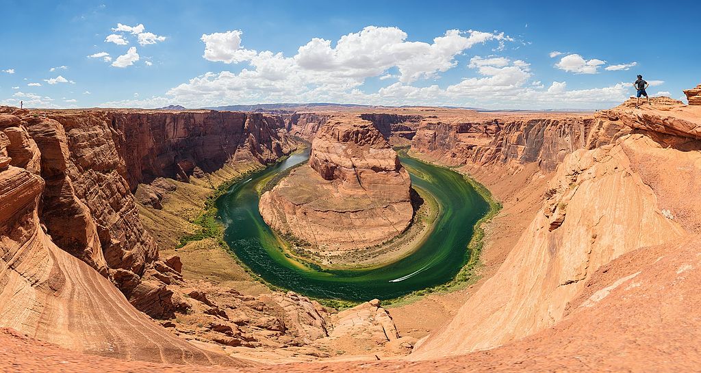 A Grand Canyon showcasing its Horseshoe Bend structure and Colorado River surrounding the structure