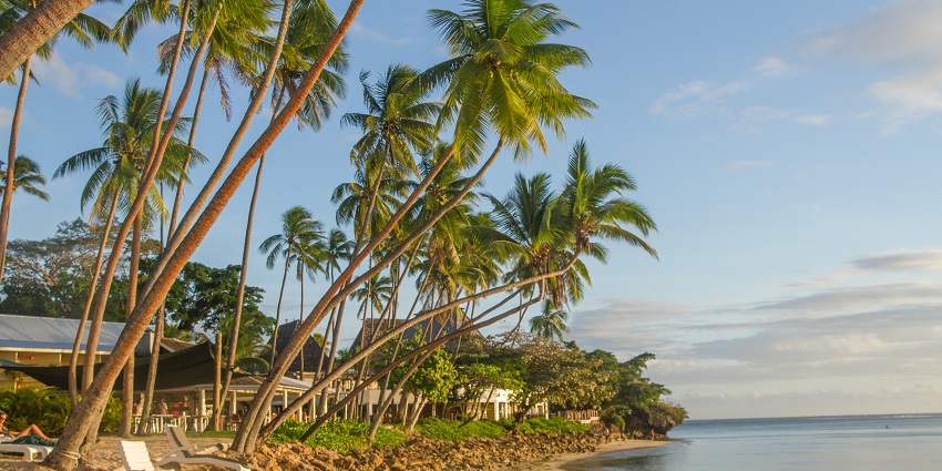 Luxury resorts near a beach lined up with tilted, one of the best things to do in Fiji.