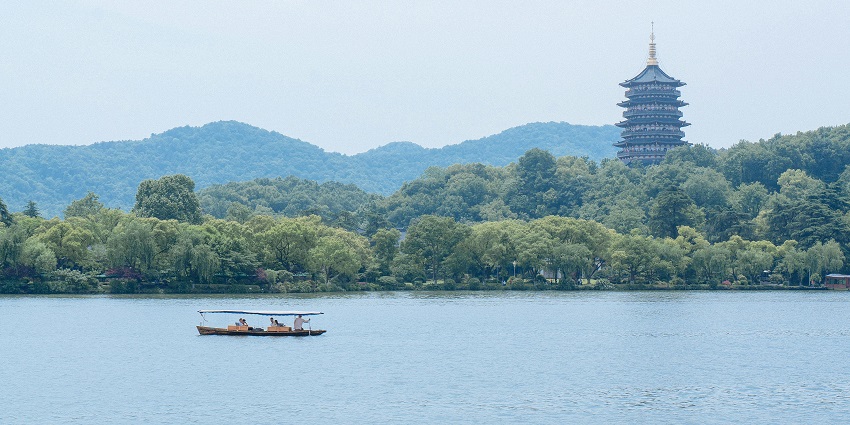 Picturesque view of West Lake with scenic surroundings and clear blue water