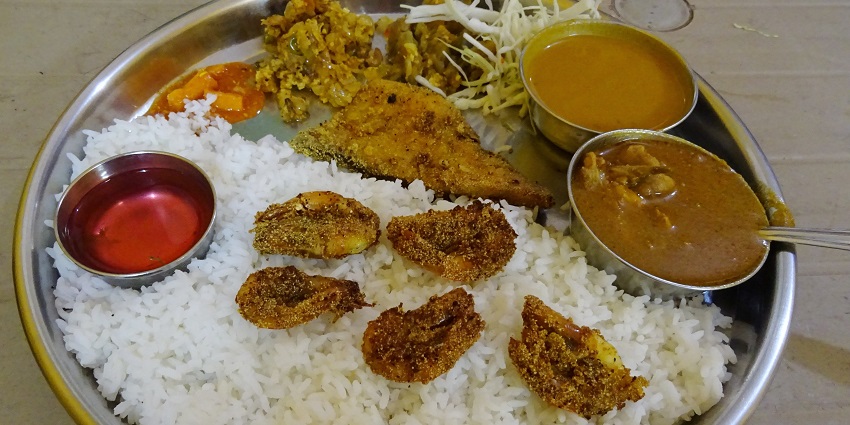 The street food in Goa includes Fish Thali, offering a true taste of local coastal cuisine.