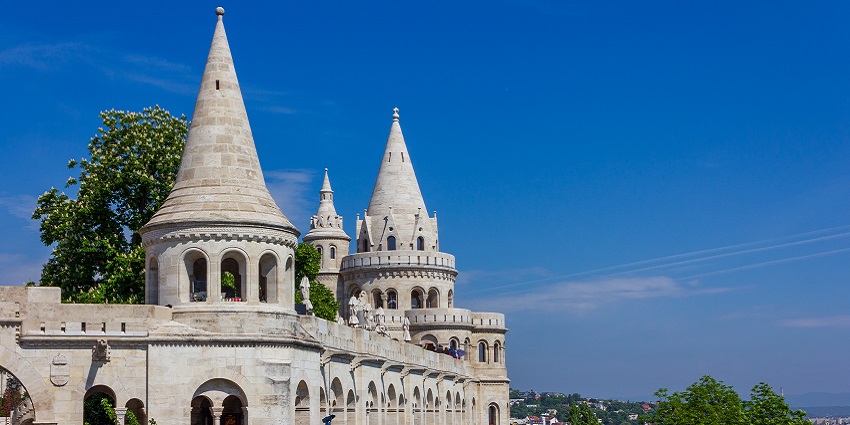 An image of a fisherman’s Bastion with its towers and panoramic views of Budapest at sunset.