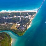 An aerial view of Fort Pierce showing the river flowing by the well-planned city.