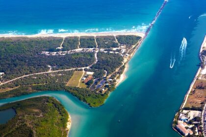 An aerial view of Fort Pierce showing the river flowing by the well-planned city.