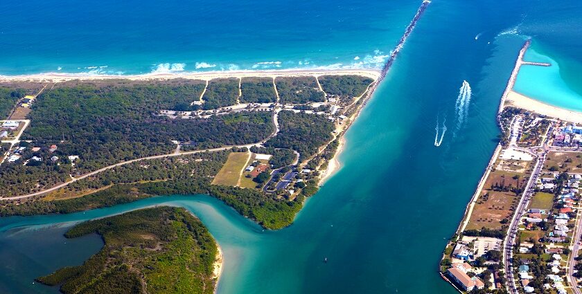 An aerial view of Fort Pierce showing the river flowing by the well-planned city.