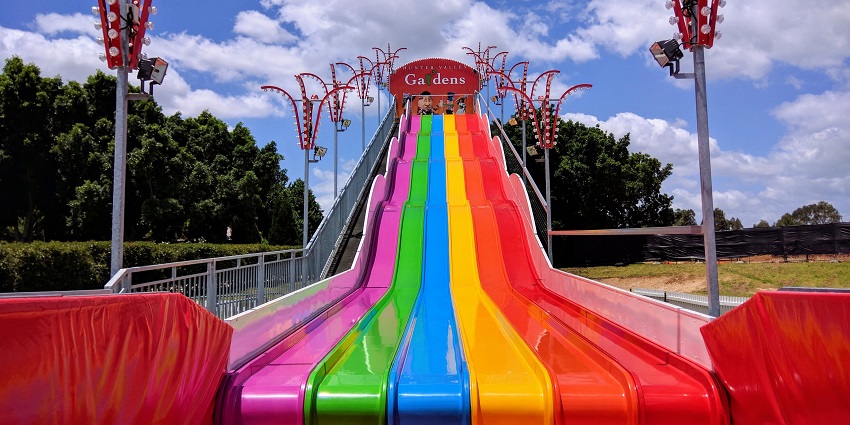 Image of a water park with colourful slides available for kids and adults