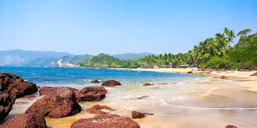 Beautiful blue water near Cola Beach in South Goa, as mentioned in the India travel guide.