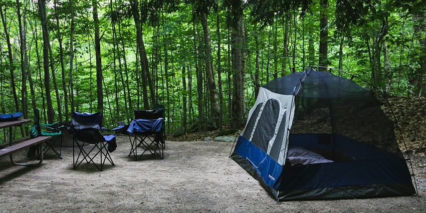 An image of a man in Grafton Notch State Park, a famous tourist place located in the US.