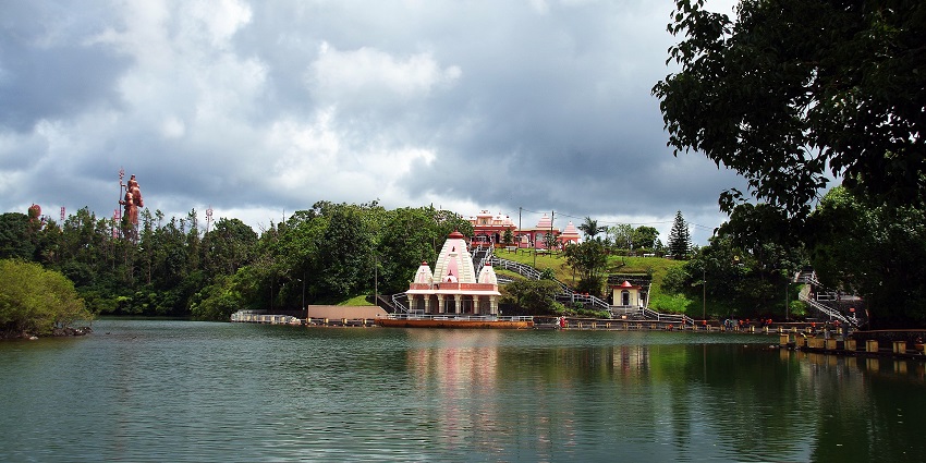 Ganga talao with people standing in line for the temple on the boundary of the water.