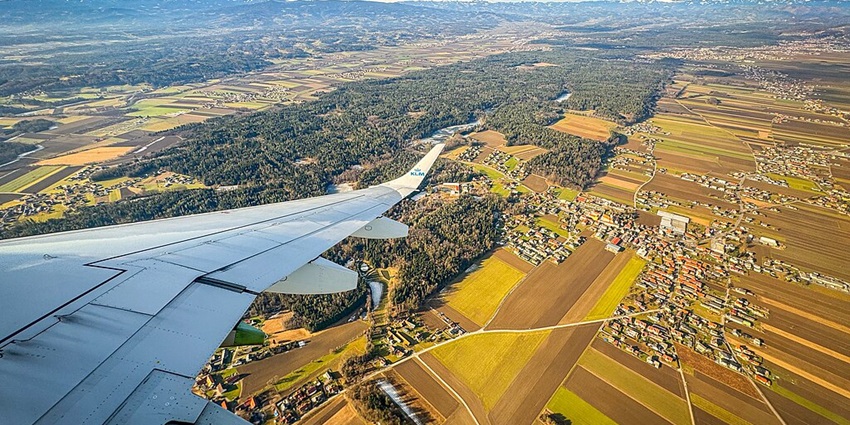 An image of A KLM Cityhopper Embraer E190 (PH-EZY) at Graz Airport, a famous airport in Austria