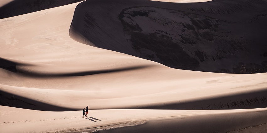 Towering dunes surrounded by stunning alpine peaks and forests.