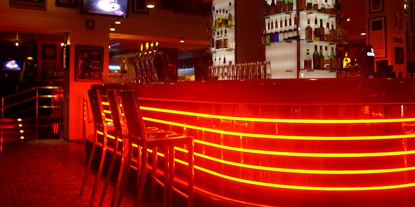 The Hard Rock Cafe features an amazing interior with music, neon signs, and a friendly atmosphere.