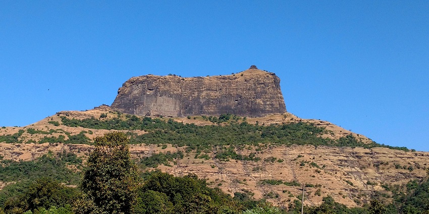 Steep, iconic fort with scenic trekking routes and breathtaking views, featured in Deolali travel guide.