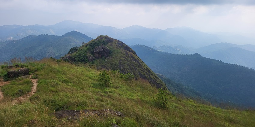 Beautiful image of a hill and its tracks leading up hills on the summit