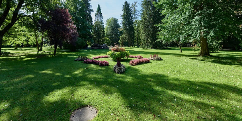 Image of a serene pathway in Hofgarten Park, among the best places to visit in Innsbruck.