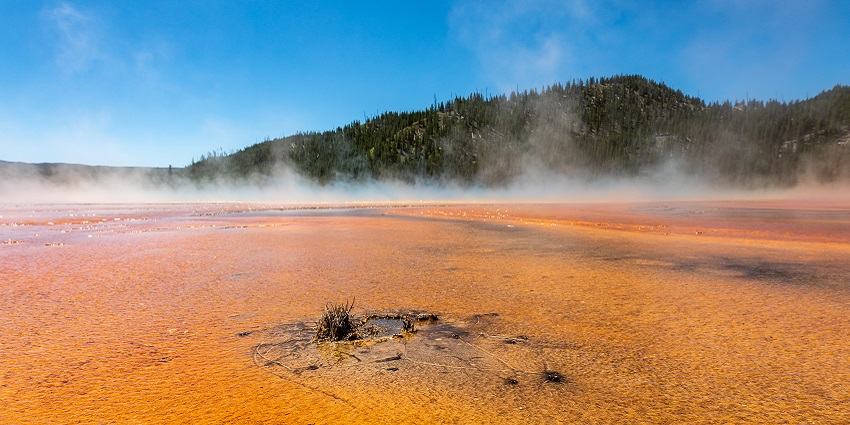 Steam rising from hot springs creating solar-like coronae effects in the air
