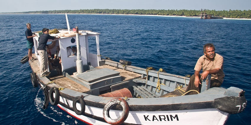 View of a Boat at Agatti surrounded by ocean Lakshadweep Union Territory.
