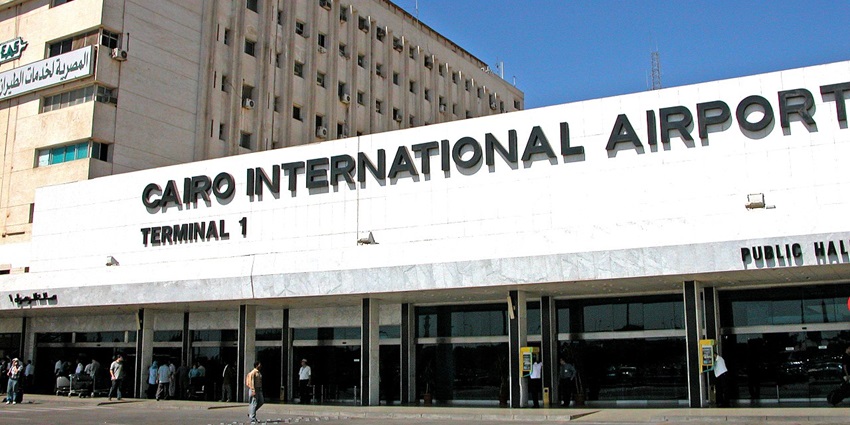 The name of Cairo International Airport is written on the outside of the building