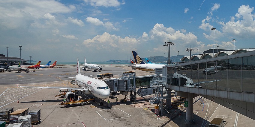 Image of Hong Kong Airport with an aeroplane on the side during day time view
