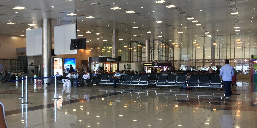 Image of inside Pune Airport - passengers are waiting for their boarding passes
