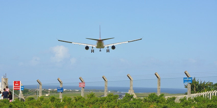 Aeroplane in mid-air about to land at the Sir Seewoosagur Ramgoolam International Airport.