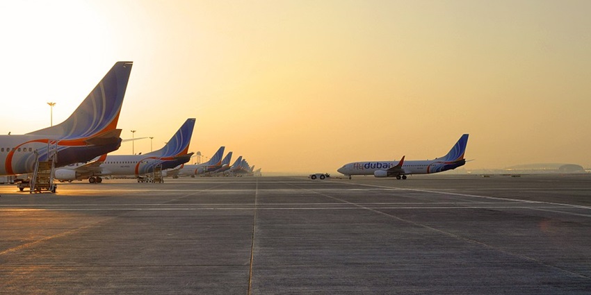 Many flights from Flydubai Airlines parked near the runway at Dubai International Airport Terminal 2.