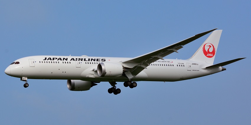 A Japan Airlines Boeing 787-9 flies over the Narita International Airport in Tokyo, Japan