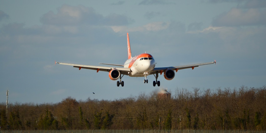A passenger aeroplane is preparing itself for making a perfect landing on the runway