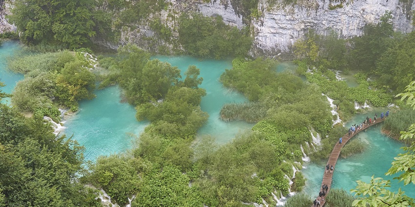An aerial view of the waterfalls at Plitvice Lakes, ideal for spending a peaceful day.