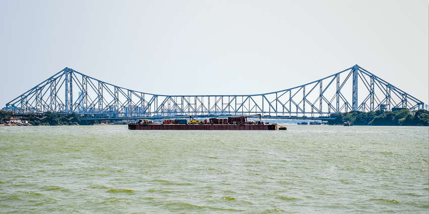 Iconic steel bridge connecting Kolkata to Howrah, guided by the Kolkata tour guide
