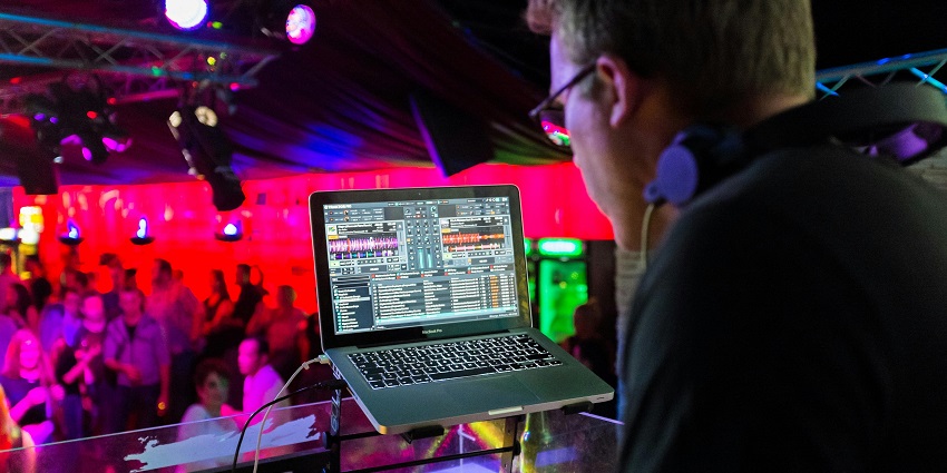 An image of the interior of Hype nightclub, featuring bright lights and a crowd dancing.