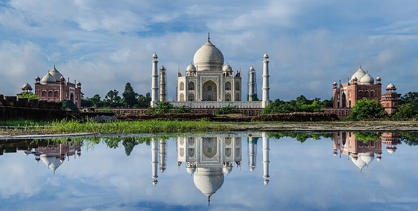 A beautiful reflection of the Taj Mahal, a testament of love in the city of Agra, as mentioned in the India travel guide.