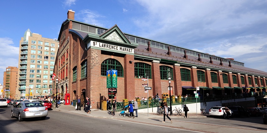 The Old City hall showcasing the St Lawrence Market signboard with few people , one of the best things to do in Toronto.