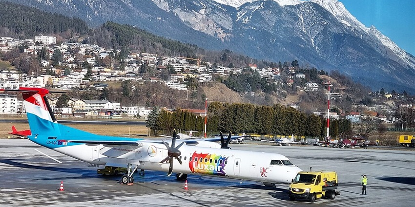 An image of a Luxair aircraft at Innsbruck Airport, a famous airport in Austria