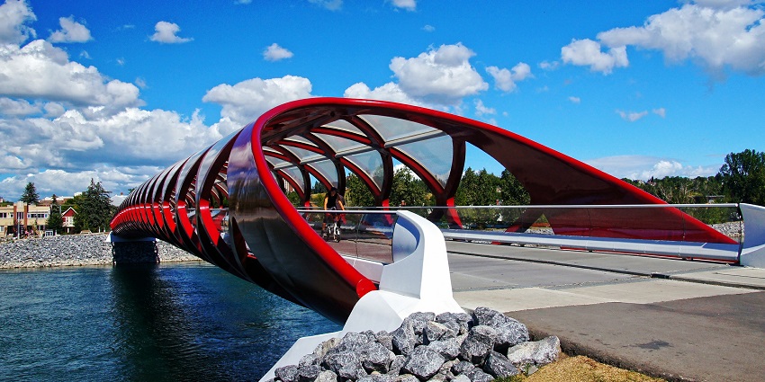 Peace bridge with unique red-covered bridge architecture and people visiting the bridge