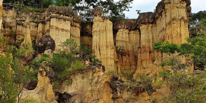 Isimila stone age site with unique structures made up of rocks surrounded by greenery