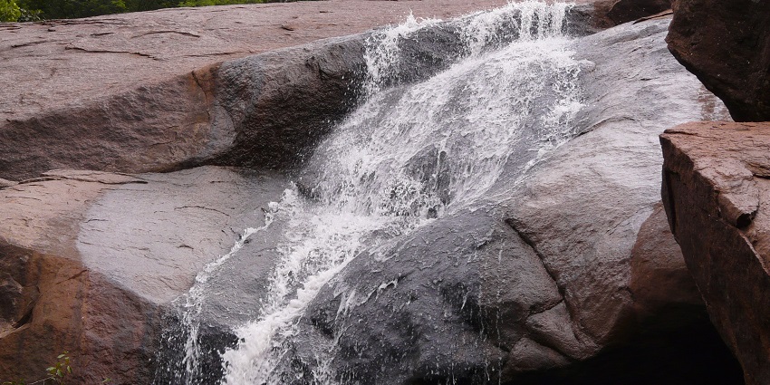 Stunning waterfall cascading amidst picturesque natural surroundings, a must-visit as per the Yelagiri travel guide