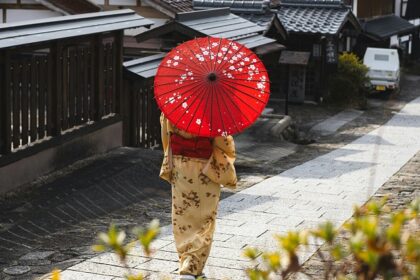 Image of a Japanese woman with traditional attire in a countryside - Japan travel guide