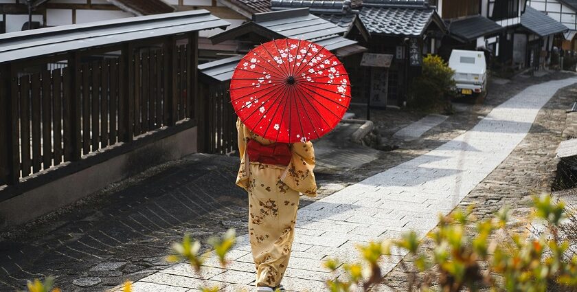 Image of a Japanese woman with traditional attire in a countryside - Japan travel guide