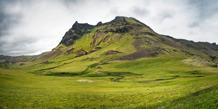 Dzukou Valley travel guide highlights a challenging trek that offers panoramic views and serene mountain landscapes