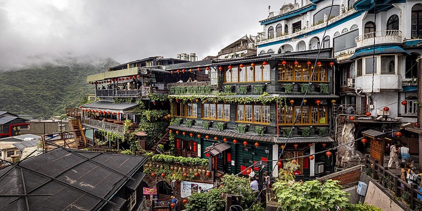 A view of charming Jiufen village with tea houses and breathtaking mountain views.