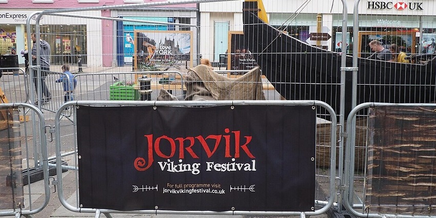 An image of people performing dramatic viking combat scenes, during the Jorvik Viking festival.