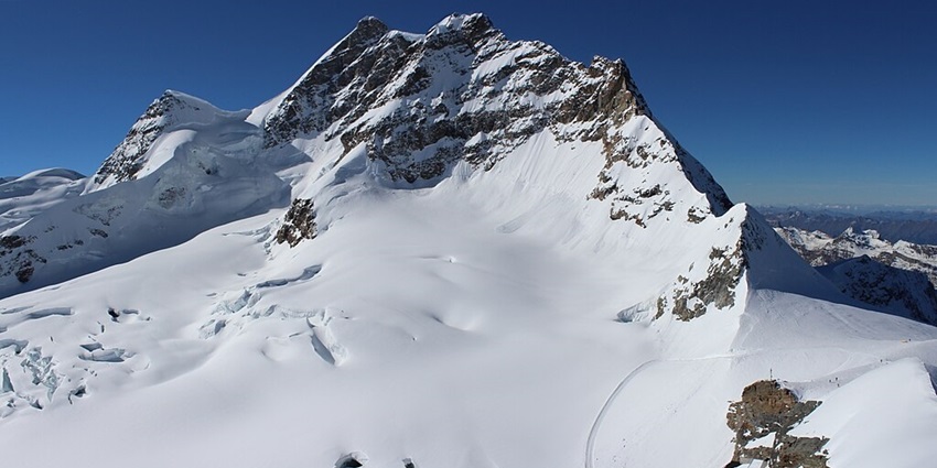 Snow-covered peak offering breathtaking alpine views and thrilling activities, showcased in Switzerland travel guide