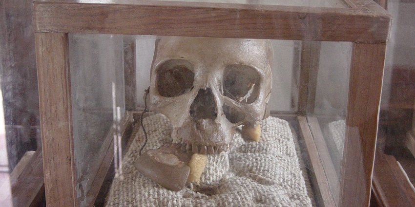 Interior of kalenga museum with mkwawa skull on a cloth sealed inside of a glass box