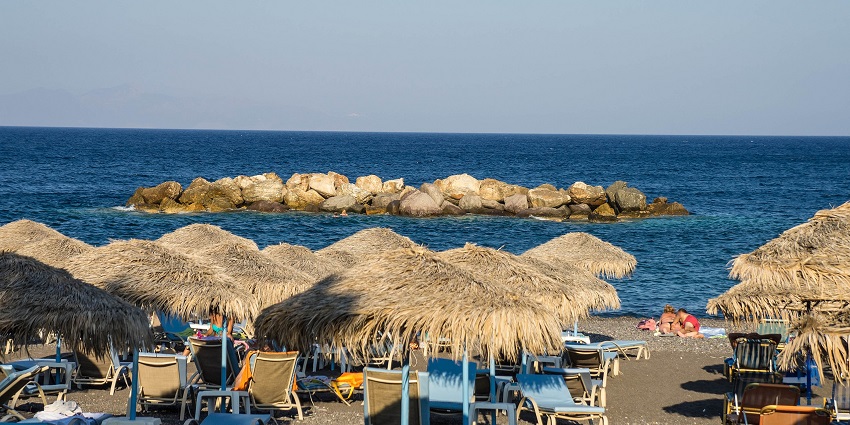 One of the black sand beaches of Santorini is Kamari, known for its lively atmosphere.