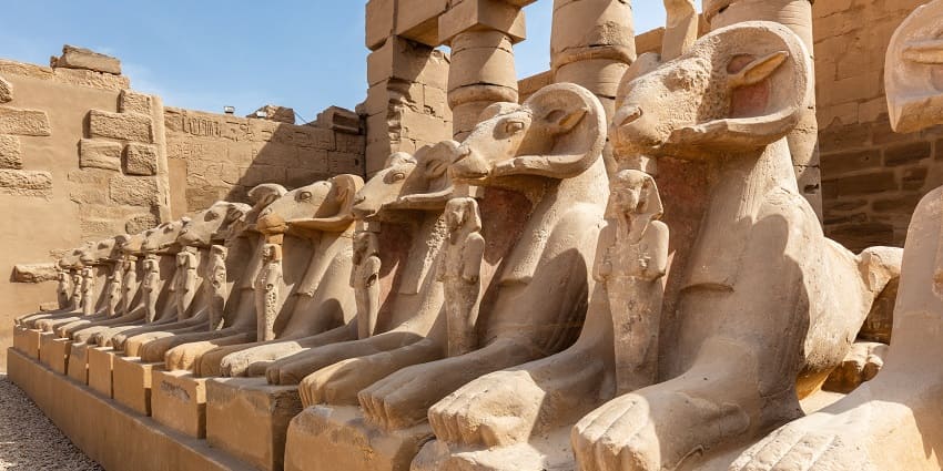 The complex of Karnak Temple is featuring ancient statues, one of the best places to visit in Egypt.