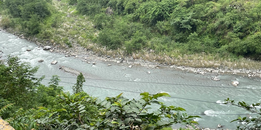 Image of a beautiful river flowing through the hills of Uttarakhand