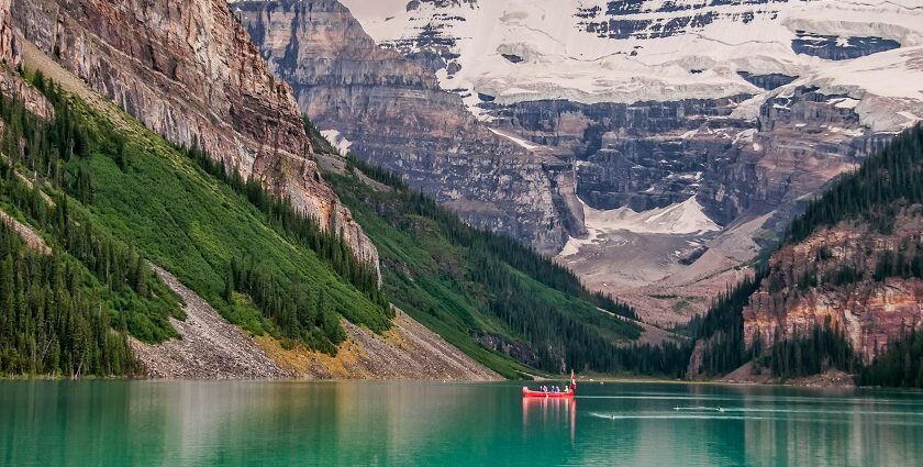 An image of a kayaker gliding through the calm waters in a famous kayaking spot in Canada.