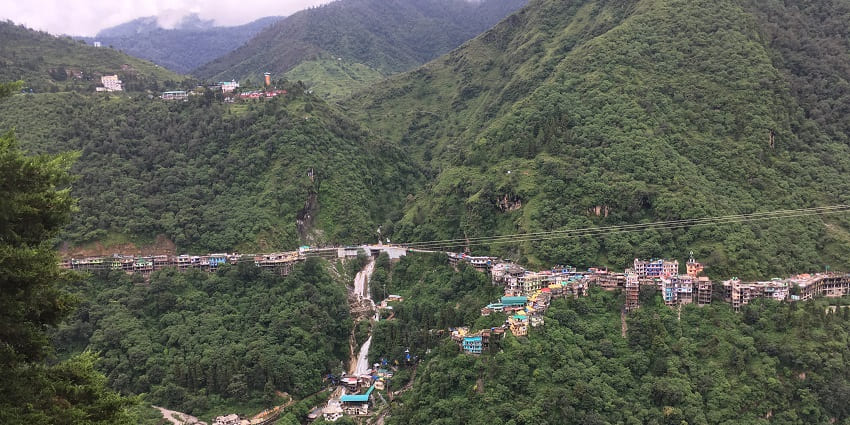 Kempty Fall picturesque view from Kempty village surrounded by lush green mountains