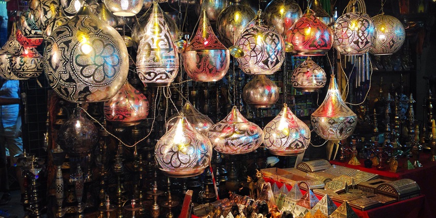 Uniquely decorated lamps hanging and decorative items on display for sale in Khan el Khalil.