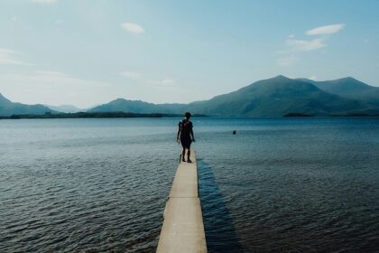 An image of a man in Killarney National Park, with Tomies Mountain in the background.